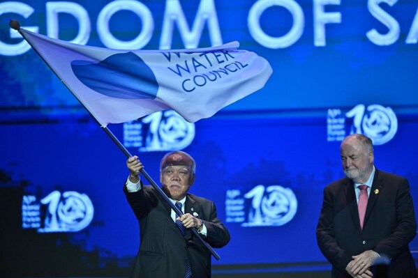 indonesian minister of public works and housing basuki hadimuljono (left), accompanied by the president of the world water council loïc fauchon, waved the world water council flag as a sign of the 10th world water forum has concluded. (prnewsfoto/secretariat of the 10th world water forum)